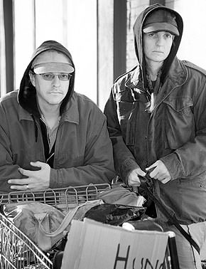 Homeless couple on street.