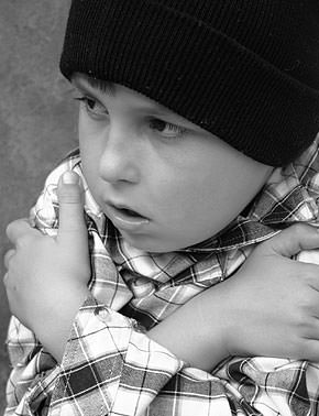 Cold child in need of a blanket.